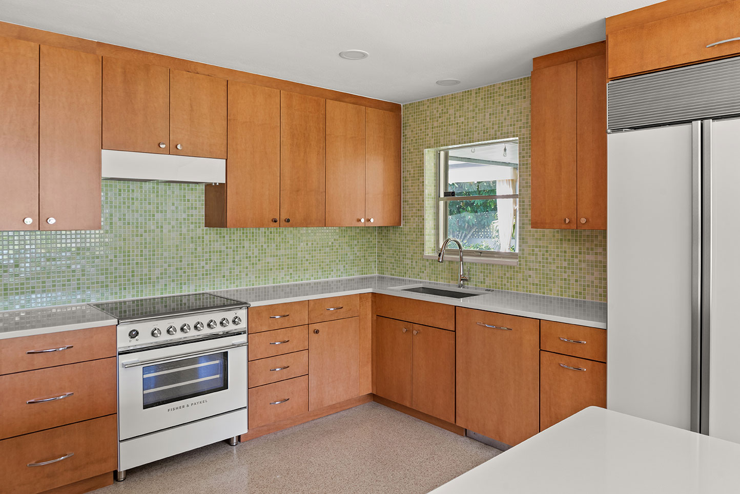 SW-Sippola-Kitchen-3 modern kitchen remodel featuring green backsplash and warm wood cabinets in brevard county, fl