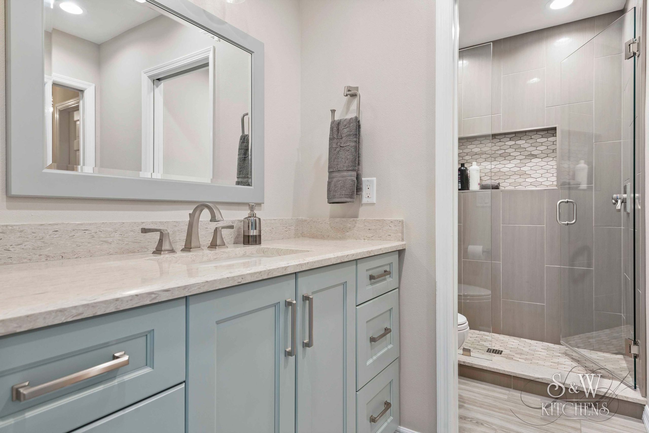 Blog-P12-SW---Andrews-Bathrooms---5 pale blue bathroom vanity in this winter park fl remodel