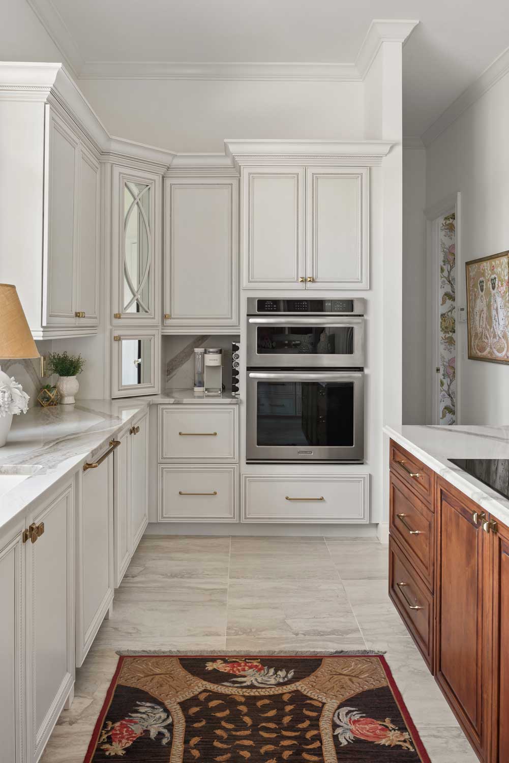 P4-03-10-23-Project-Reveal-Gorgeous-Glam-Kitchen-with-Floral-Laundry-Room kitchen remodel in seminole county fl featuring white custom cabinets and hidden appliances