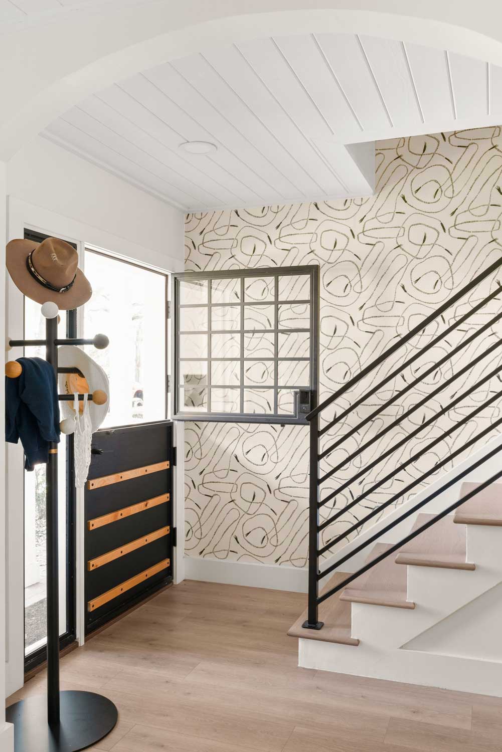 04-14-23-Outdated-1960s-Cottage-Transformed-into-Beautiful-Modern-Oasis-P14 dutch door in black with warm wood in tampa fl
