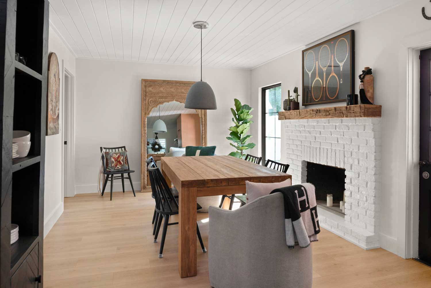 04-14-23-Outdated-1960s-Cottage-Transformed-into-Beautiful-Modern-Oasis-P7 white and wood fireplace in tampa fl