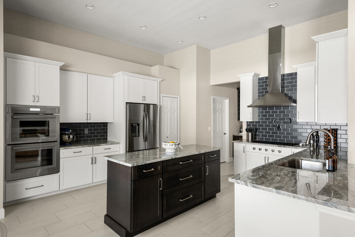 S-W-Stinnett--4--720x481-6d7d1e4e-5830-4daf-ae03-f2c5711f584a white kitchen with navy backsplash