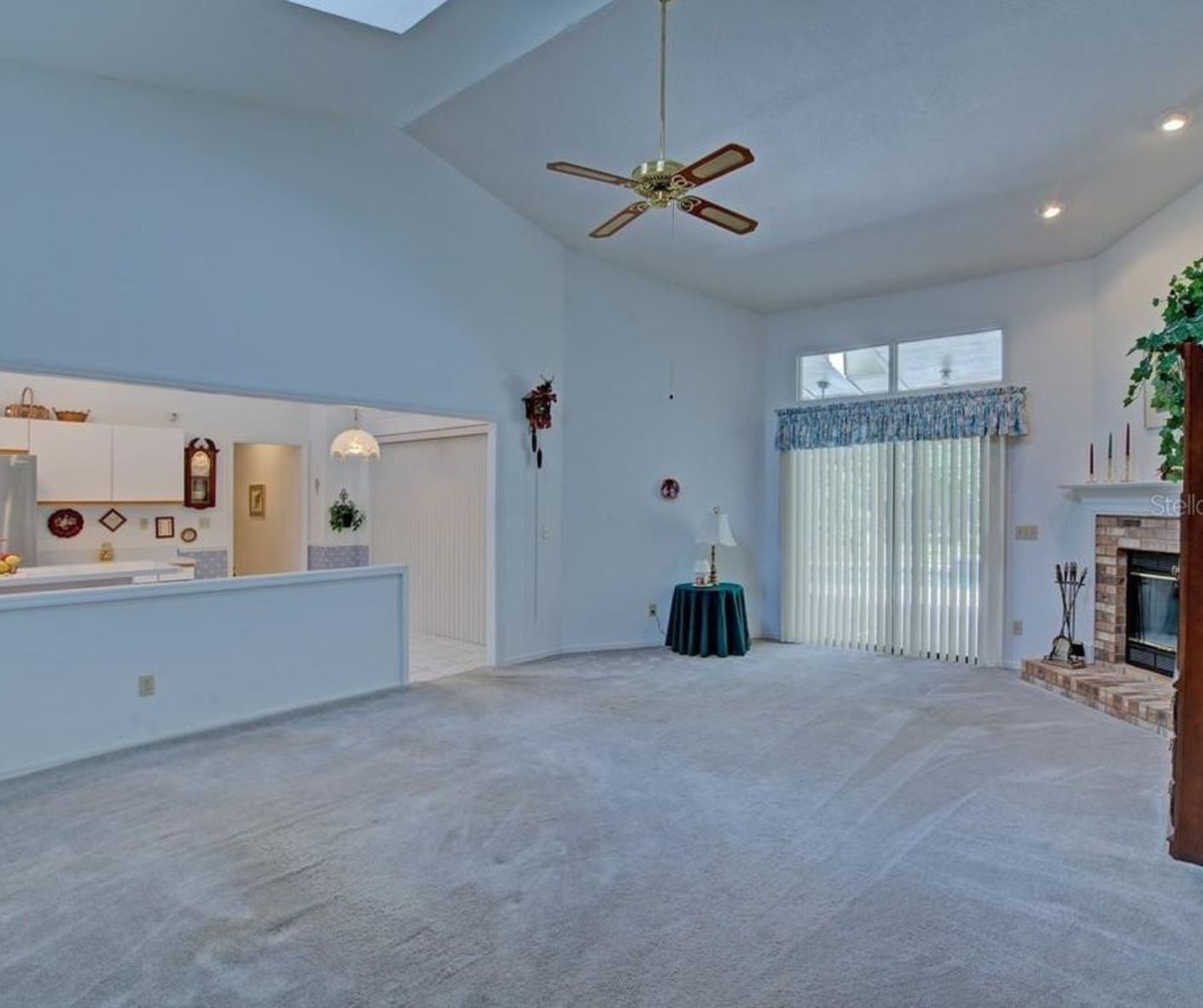 2 before photo of an outdated living area and kitchen